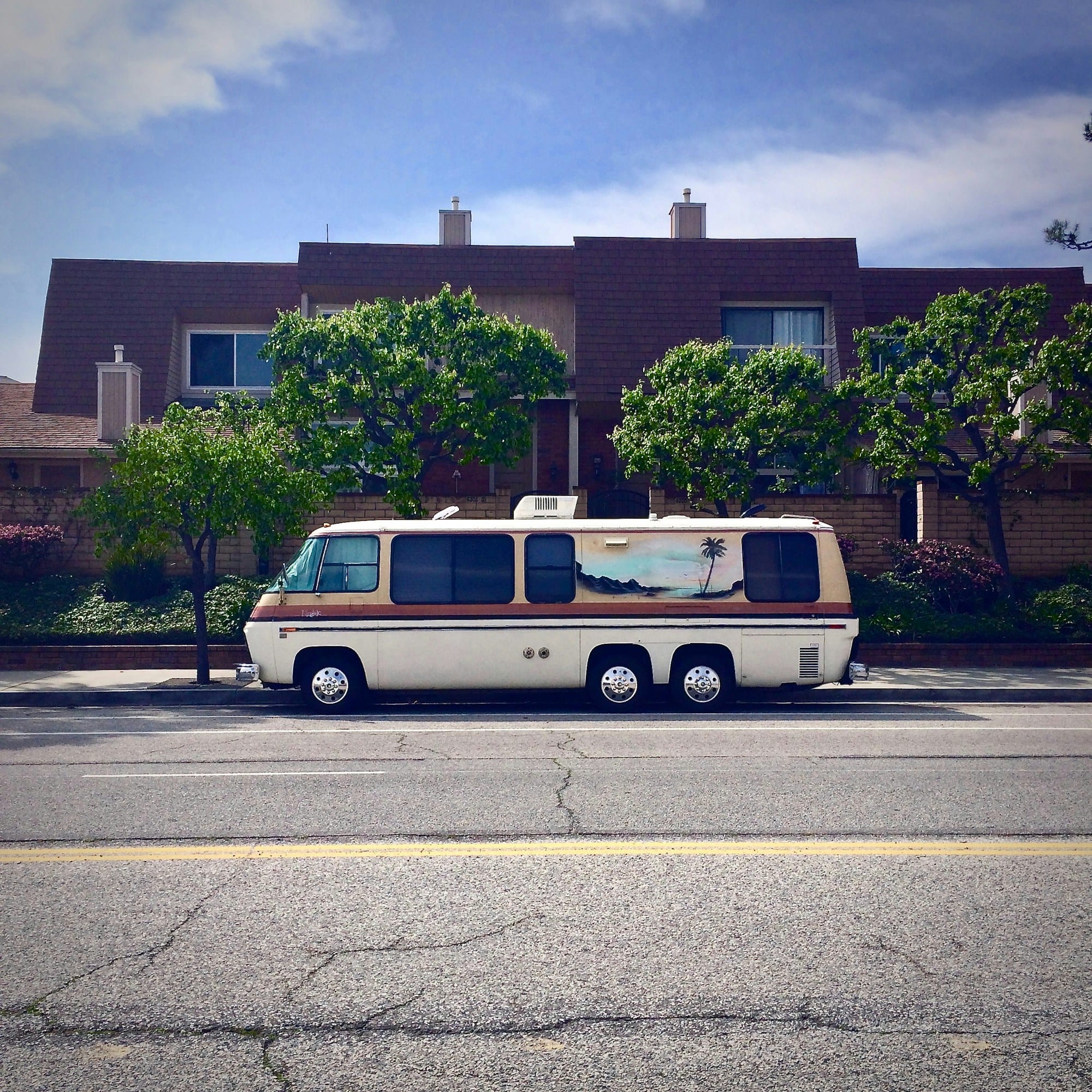 An unmarked white van at the curb — the vehicle a fake locksmith listing usually arrives in