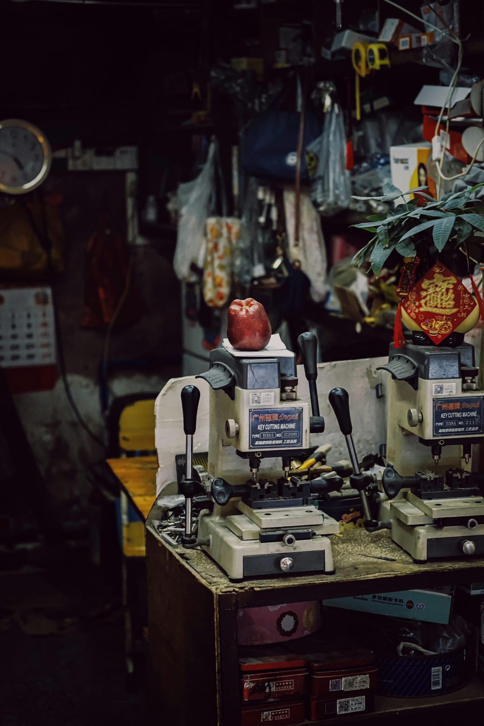Technician cutting a new key at the workshop bench